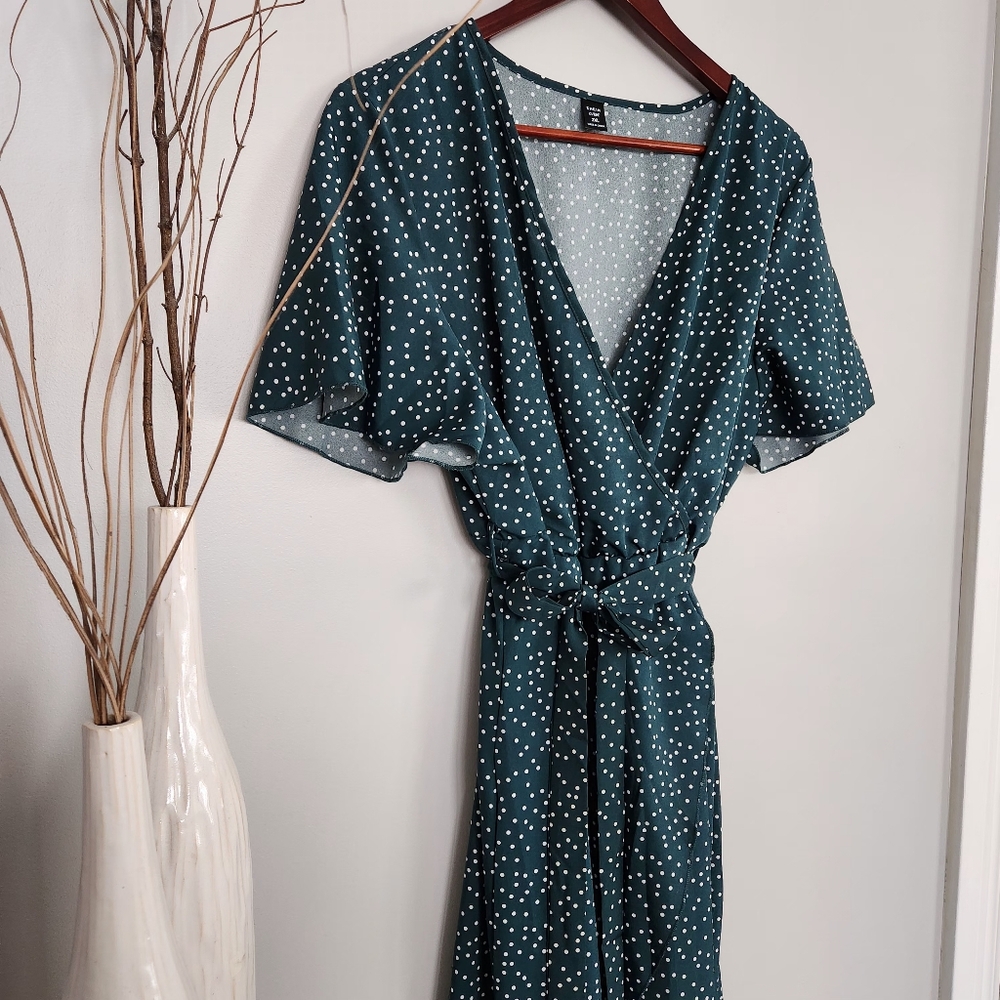 Womans green polka-dot wrap dress